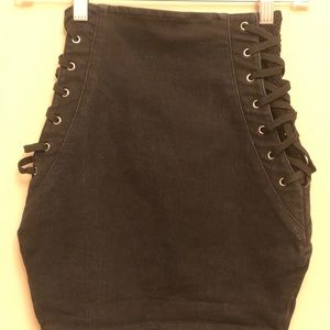 Black denim soft mini skirt. Mesh paneling.